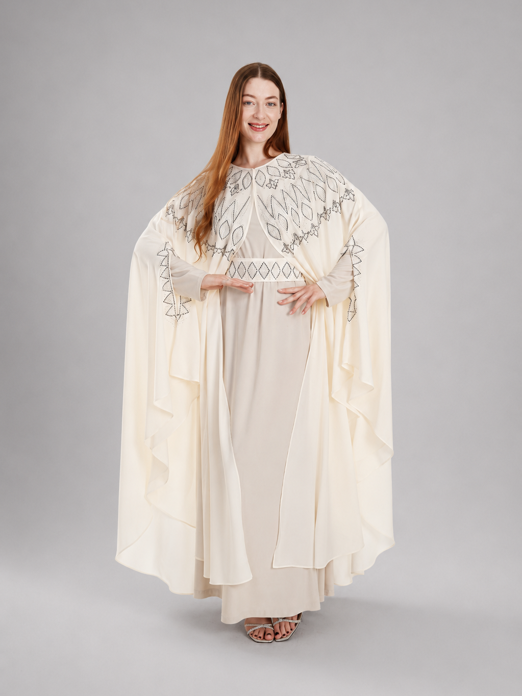 "Falla" bisht embellished with rhinestones.