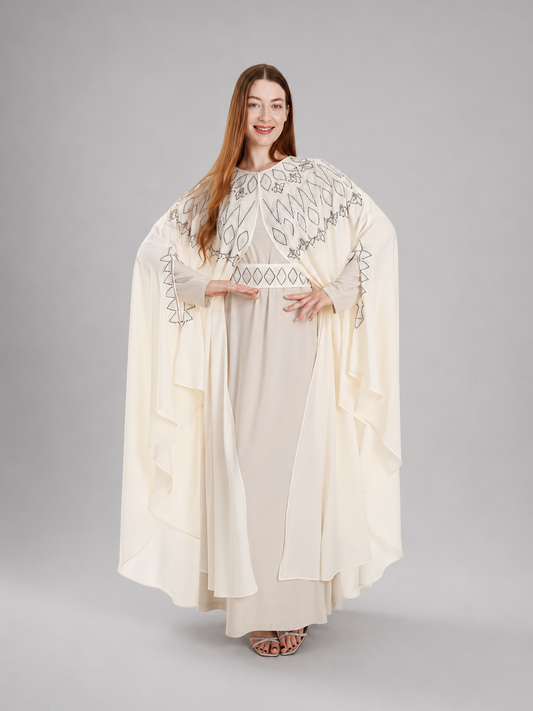"Falla" bisht embellished with rhinestones.