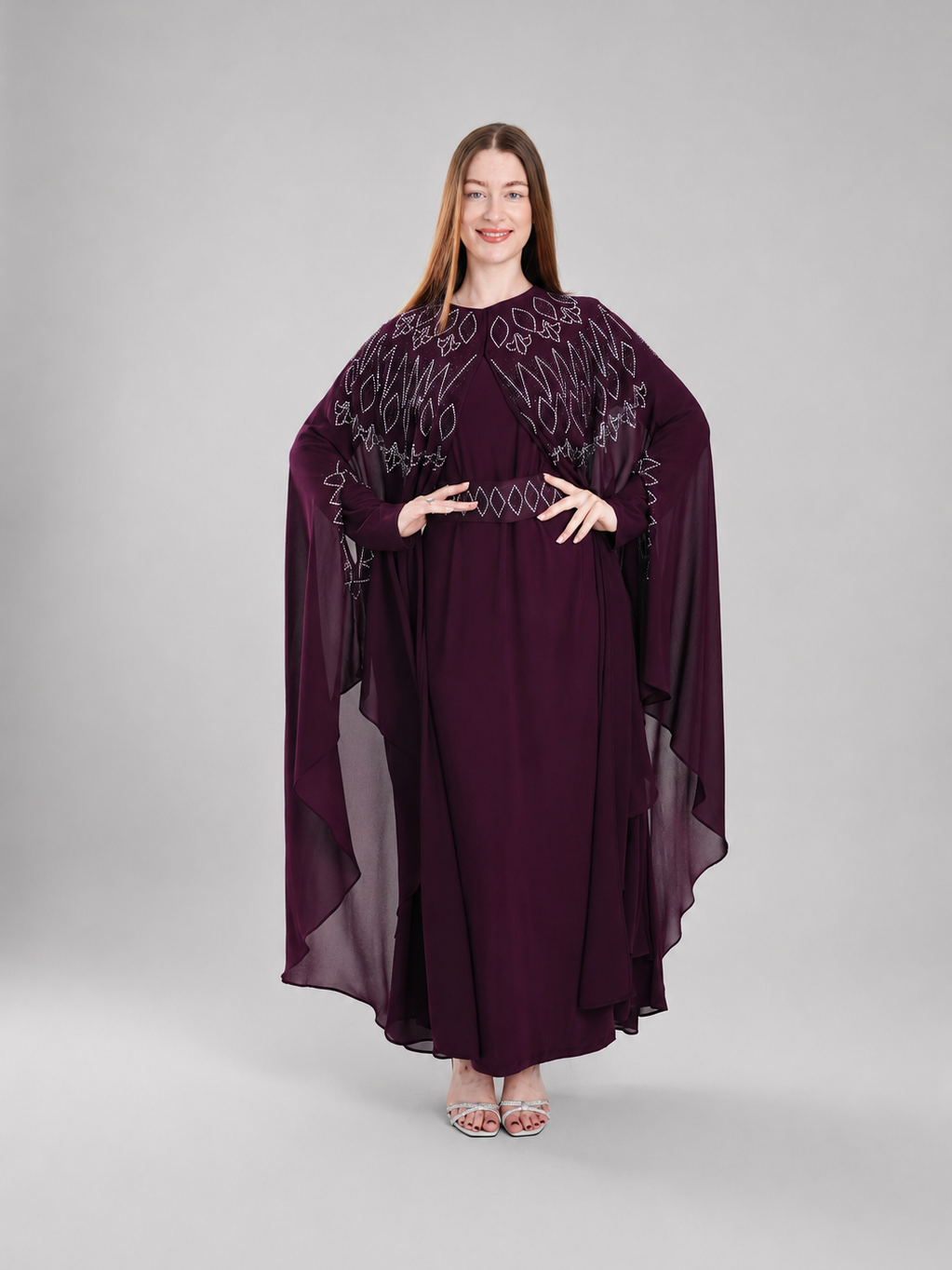 "Falla" bisht embellished with rhinestones.